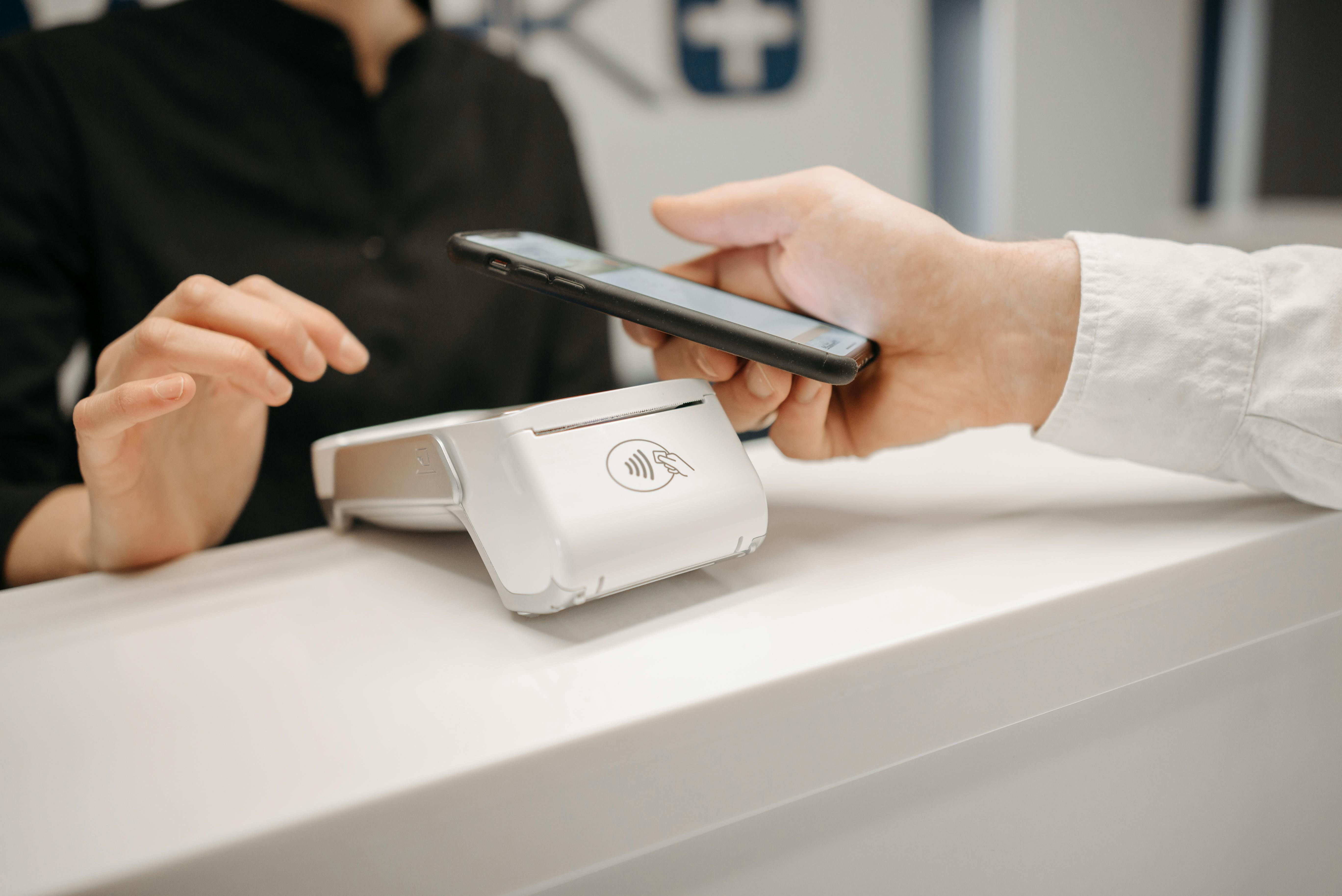 Staff member using a phone at a service counter